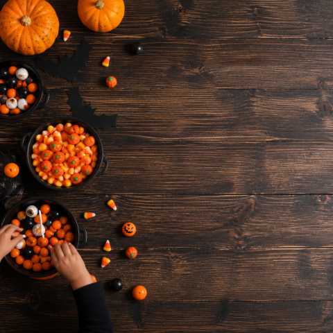 Halloween candy hand rustic wood copy space