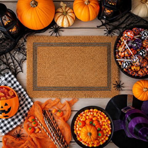 Halloween party doormat candy pumpkin flat lay
